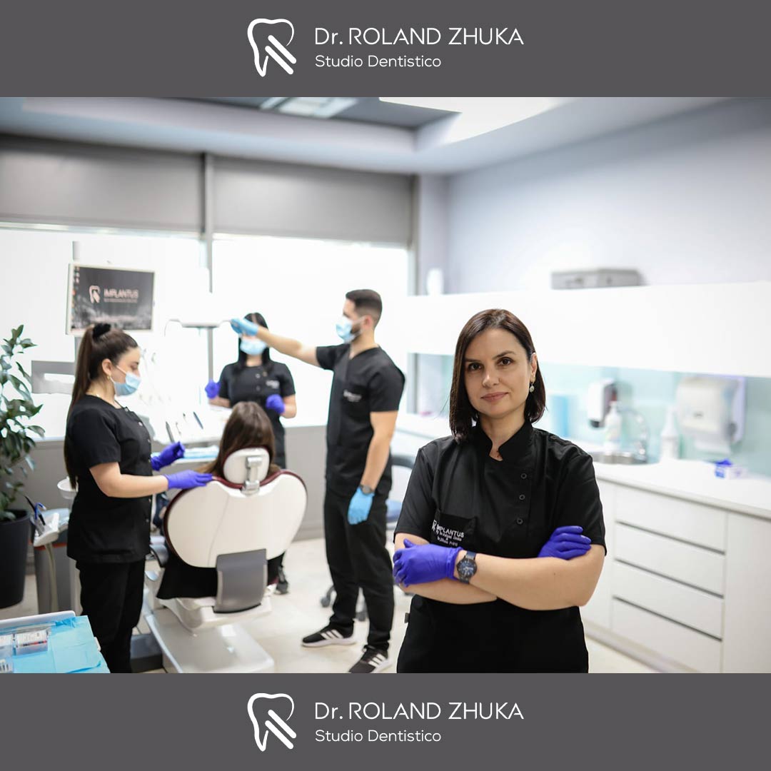 Dr. Eliona Prifti with her team at Implantus Dental Clinic