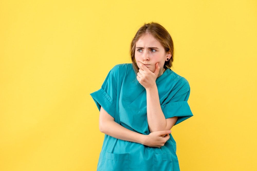 Image illustrating a patient thinking about questions related to their dental procedure